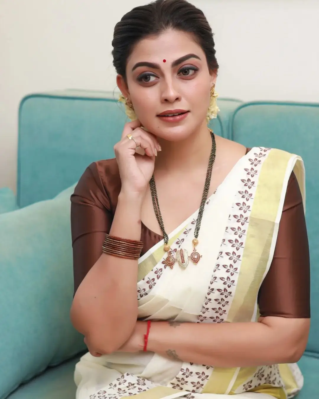 Anusree Nair Wearing Beautiful Earrings Jewellery White Saree Maroon Blouse